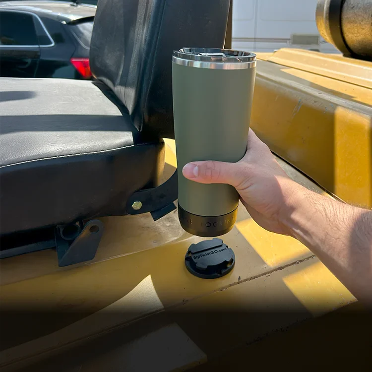 Mini disc locking cup holder with a blue twistlock tumbler locked into it on a forklift.