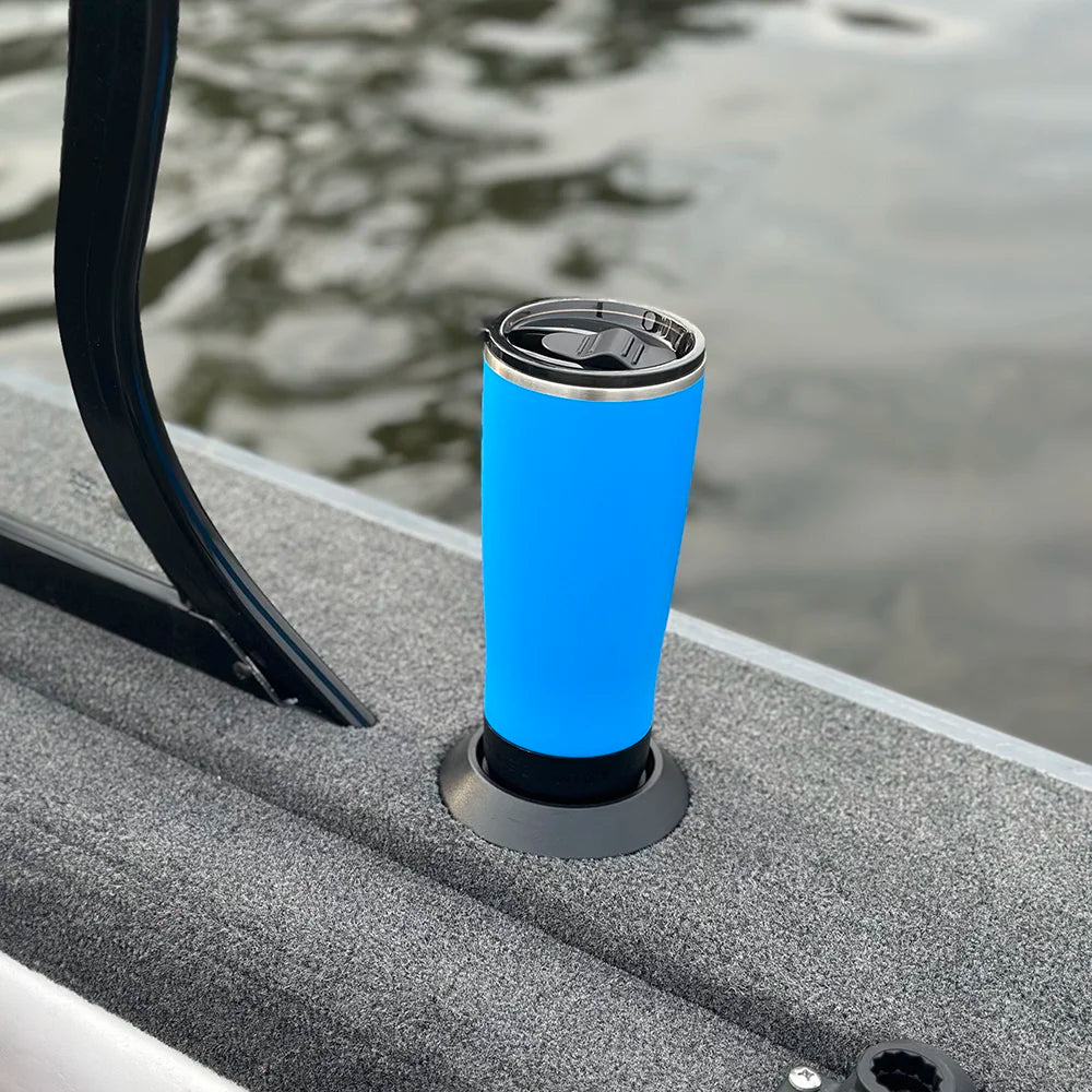 Blue tumbler on flat mount attachable locking cup holder base. It is secured to a bass fishing boat.
