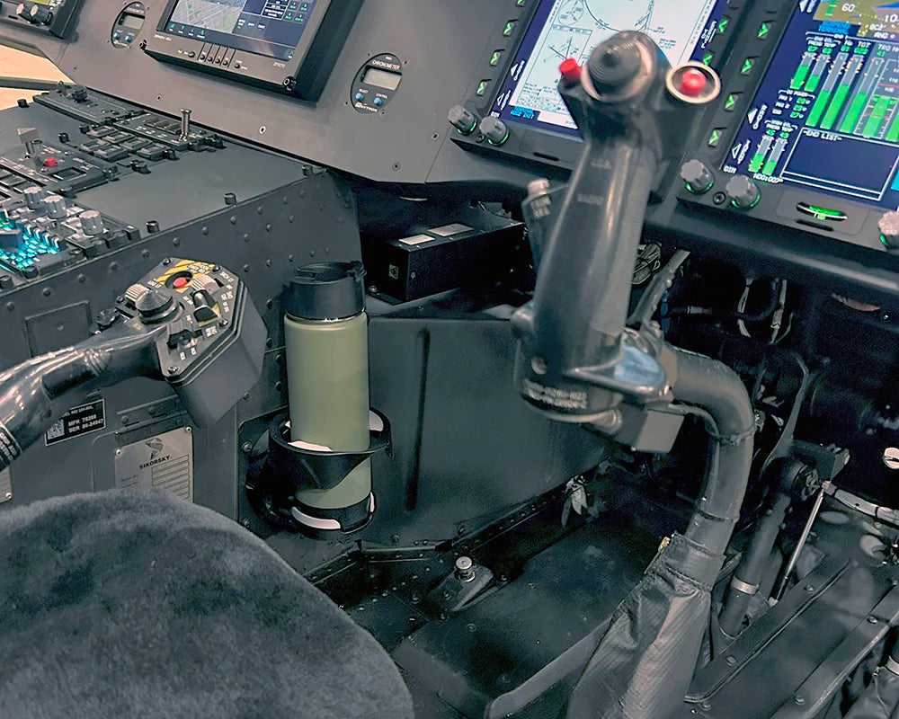 TwistLock Vertical Mount attached in the cockpit of a Black Hawk Helicopter with a Green Canteen securely locked in.