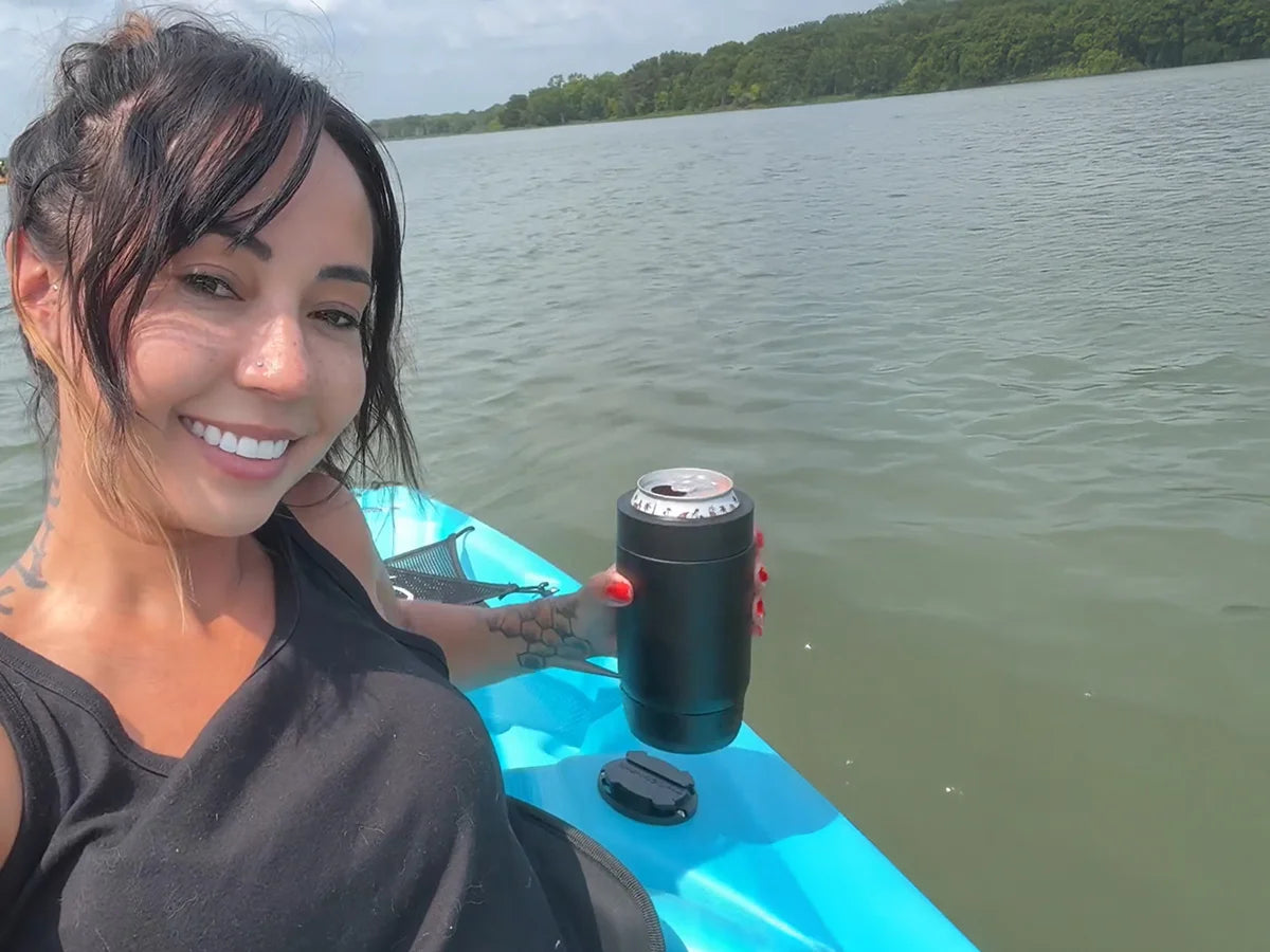 Kayak with TwistLock Mini Disc Flat Mount attachable cup holder and a can cooler being locked in.