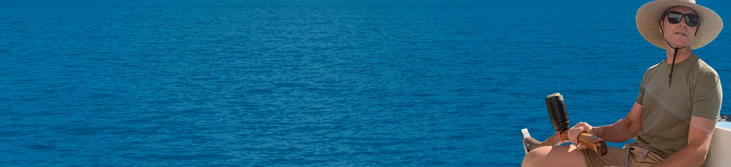 Desktop hero for the locking cup holder collection. Image features a man on a sailboat with a TwistLock Insulated Can Cooler attached to his tiller with a Bar Mount Locking Base attachable cup holder.