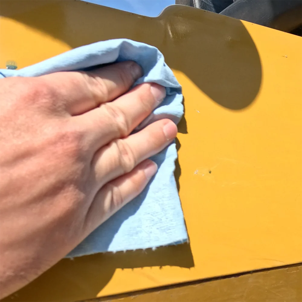 Step 1 of installing the Vertical mount cup holder using adhesive: Clean the surface thoroughly.