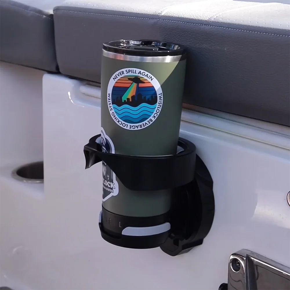 TwistLock Vertical Mount Folding, Locking Cup Holder with a Trailhead Green insulated tumbler secured into it. The cup holder is mounted to a boat using the included adhesive.