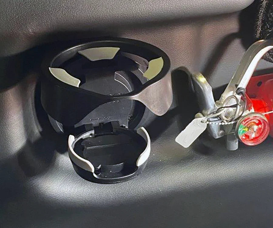 The Vertical Mount in the open position attached to the inside panel of a personal airplane.