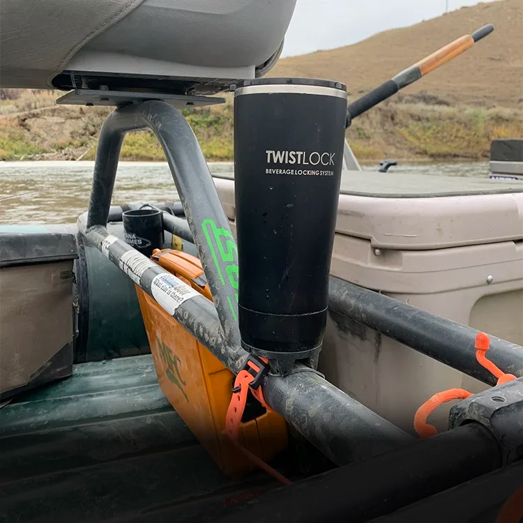 Tumbler and bar mount cup holder attached to a raft frame.