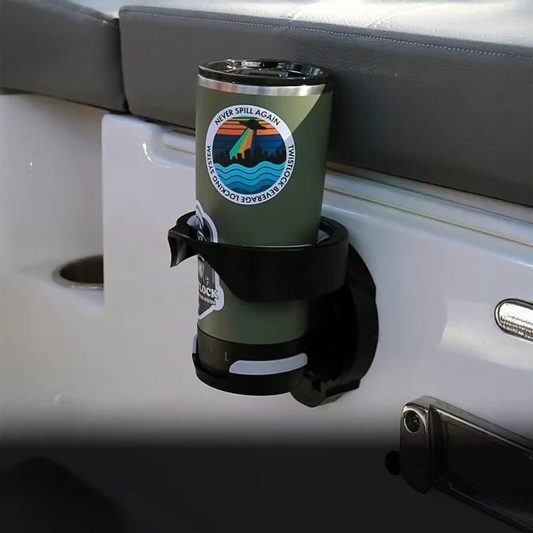 TwistLock Green insulated locking tumbler secured to the vertically mounted folding cup holder on a boat.