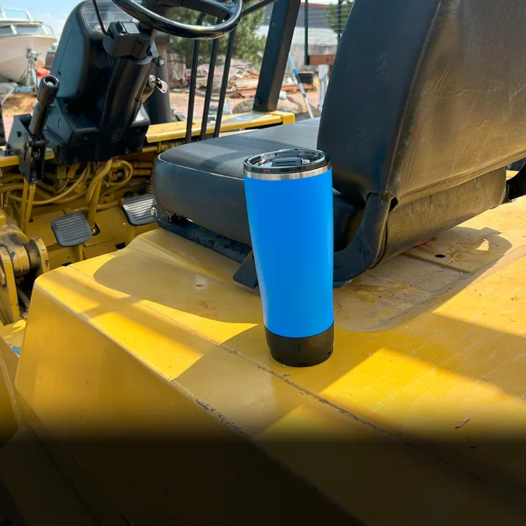 Mini disc locking cup holder with a blue twistlock tumbler locked into it on a forklift.