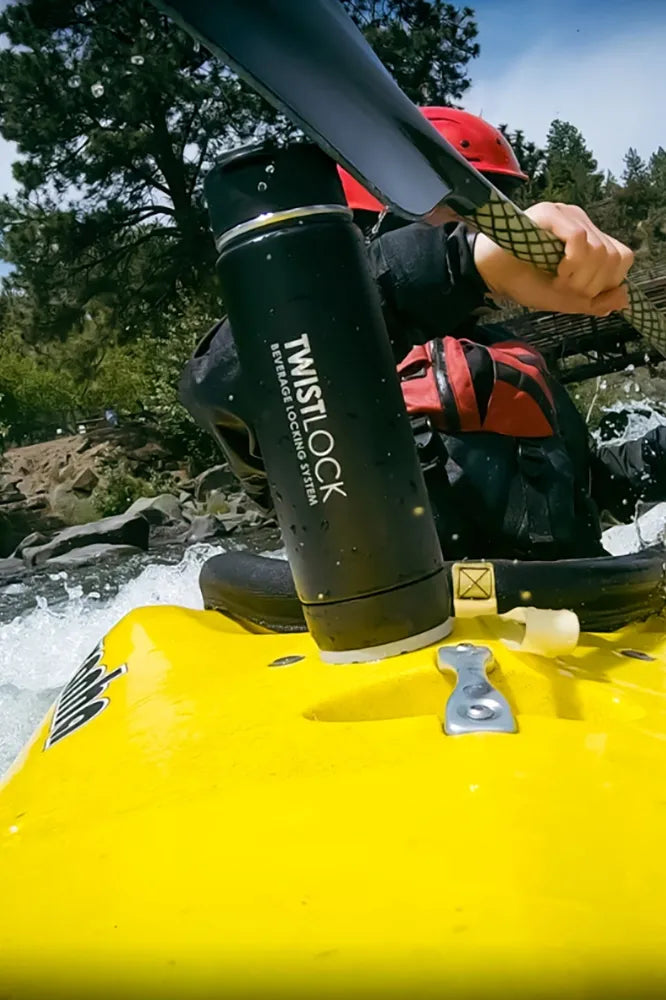 Attachable kayak cup holder with stainless steel insulated canteen securely attached to it.