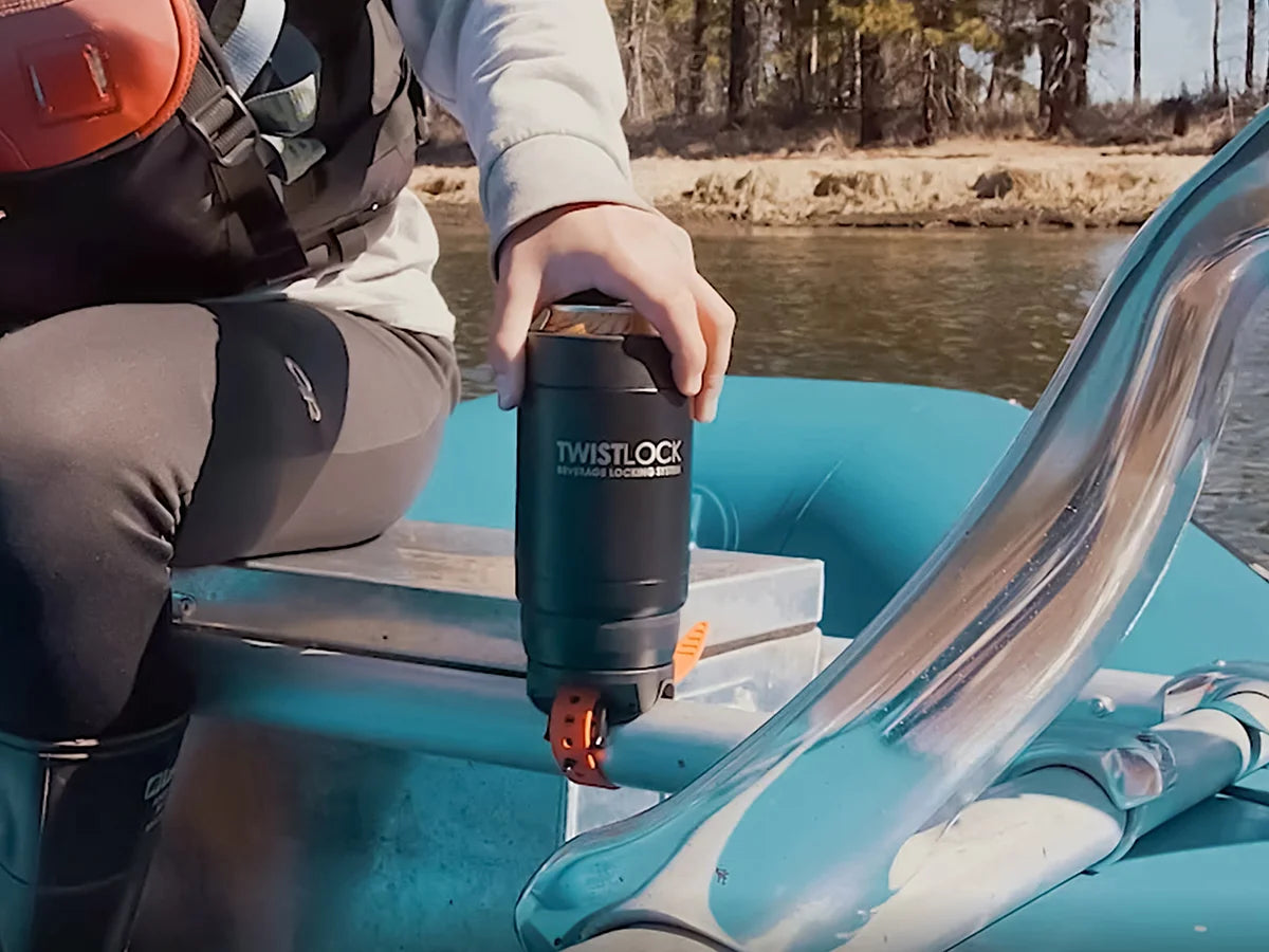 Whitewater raft bar mount TwistLock cup holder attached to the frame with a insulated can cooler being locked in.