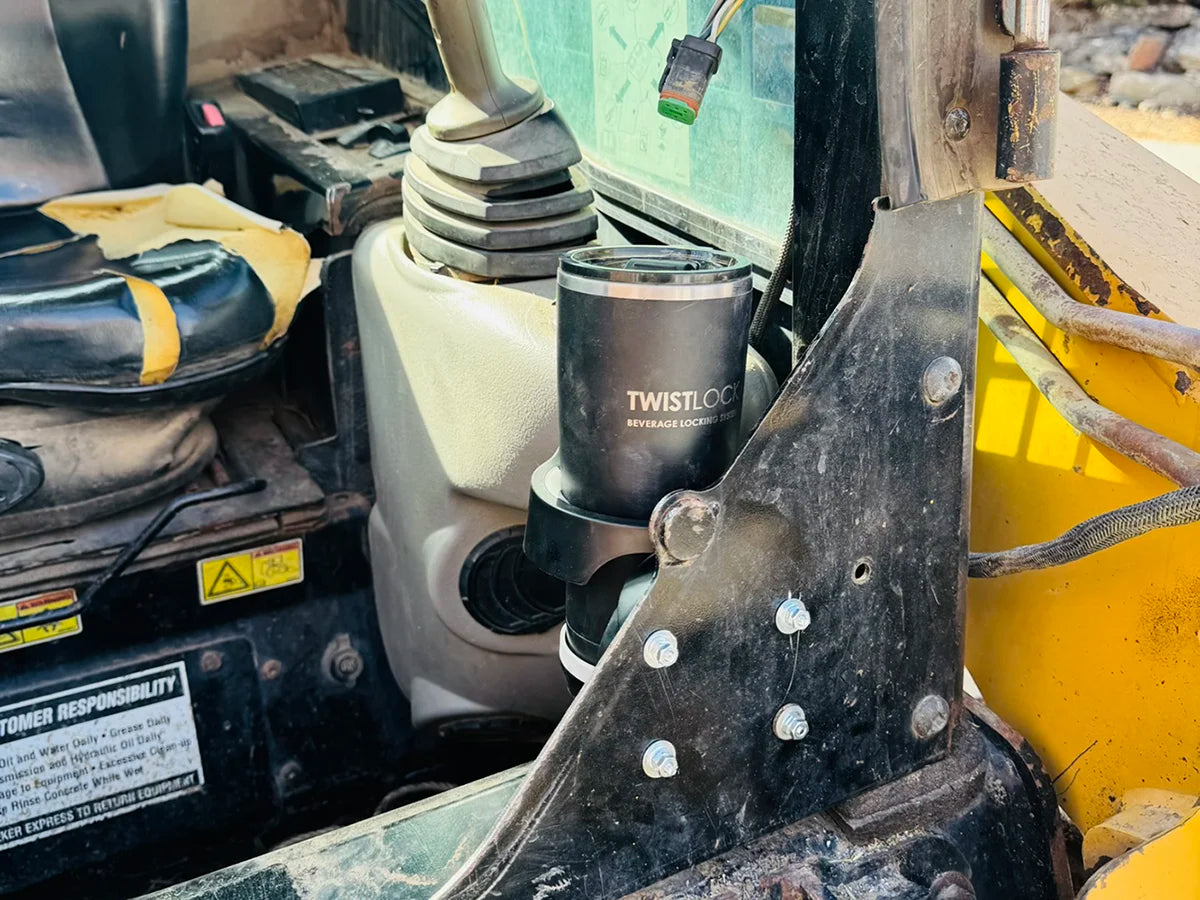 Skid Steer Equipment with TwistLock Vertical Mount attachable folding cup holder and insulated Tumbler.