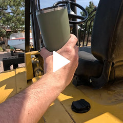 Showing a Trailhead Green TwistLock tumbler being locked into and out of a mini disc locking cup holder on a forklift.